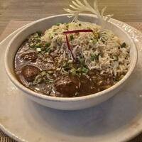 Slow-cooked curry with fragrant rice — Spoon Haus Ludhiana
